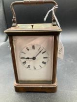 A brass repeating carriage clock complete with key slight crack to front glass
