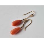 A pair of gold mounted coral earrings