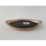 An oval tea pot stand with reeded rim, wood base, 7" long, London 1895