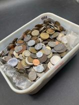 Heavy tub of world coins