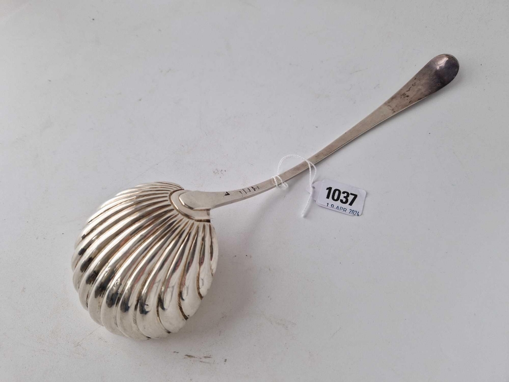 An early George III soup ladle with shell shaped bowl and wriggle work engraved border, London 1776, - Image 2 of 3