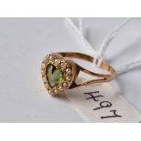 An antique gold and peridot heart ring, size R