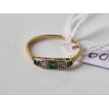 A five stone emerald and diamond ring, 18 ct, size M, 1.3 g