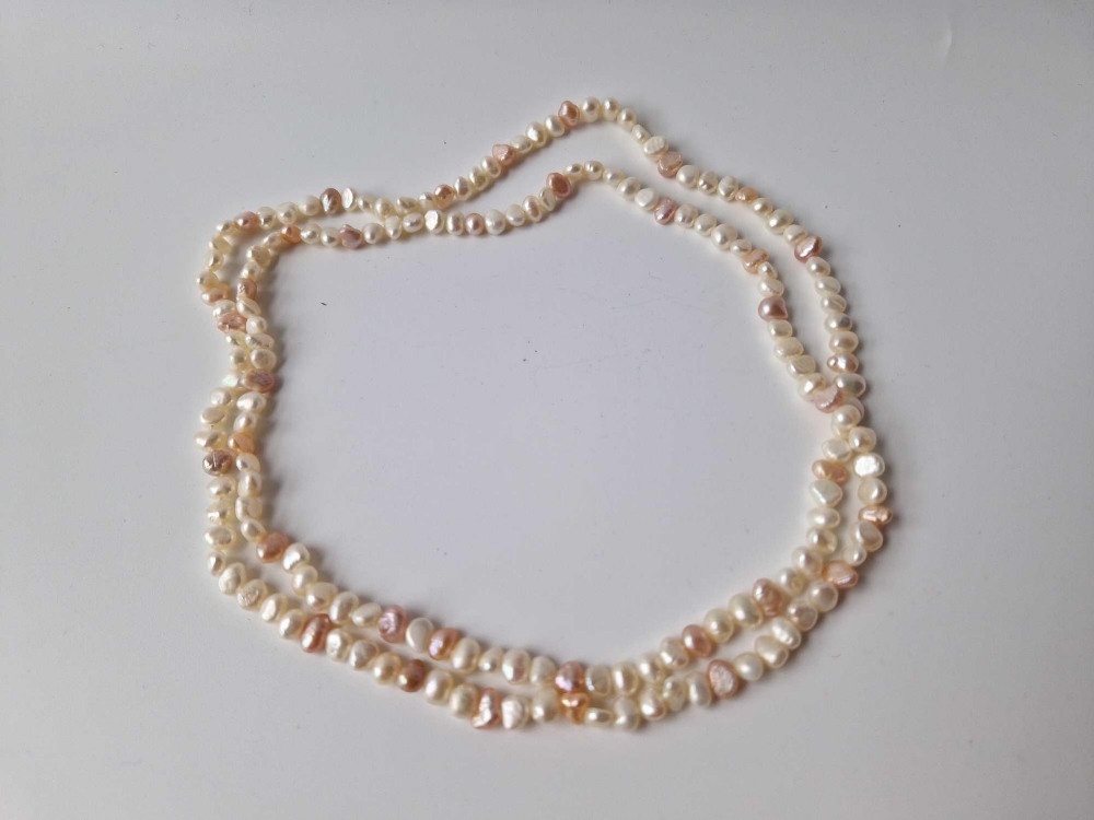 A good string of natural fresh water pearl 36” long