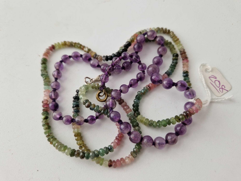 A amethyst bead necklace and muti gem set necklace