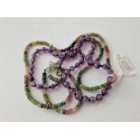 A amethyst bead necklace and muti gem set necklace