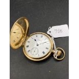 A gilt hunter pocket watch by WALTHAM with seconds dial