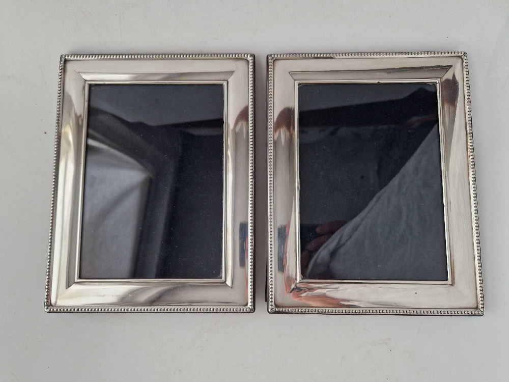 Another pair of photo frames with beaded edges, 9" high