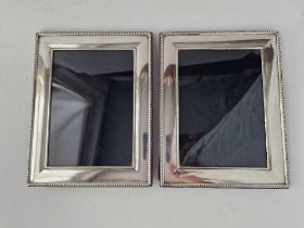 Another pair of photo frames with beaded edges, 9" high