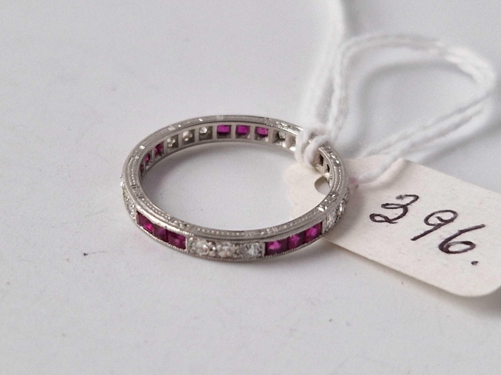 A WHITE GOLD DIAMOND AND RUBY ETERNITY RING, 18ct, size L