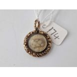 A Georgian locket with crisp chased border plaited hair centre the back dated 1829 6.4 gms inc.