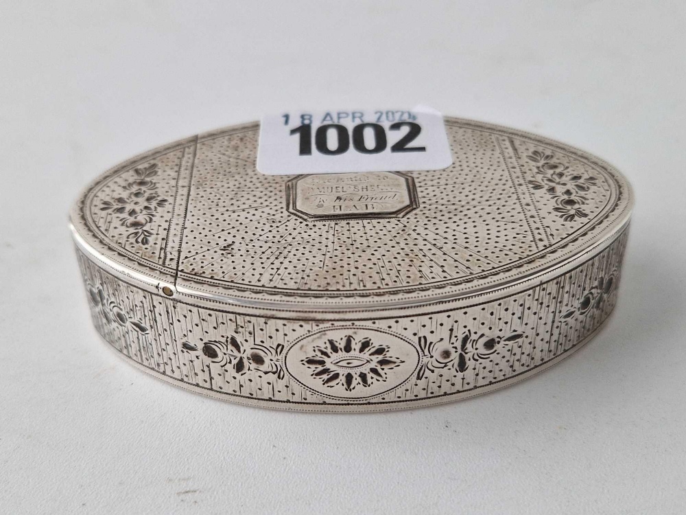 A George III oval snuff box with bright cut decoration, gilt interior, 3 1/4" long, London 1809 by