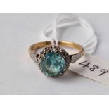 A BLUE ZIRCON AND DIAMOND CLUSTER RING, 18 ct, size O, 3.8 g