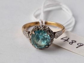 A BLUE ZIRCON AND DIAMOND CLUSTER RING, 18 ct, size O, 3.8 g