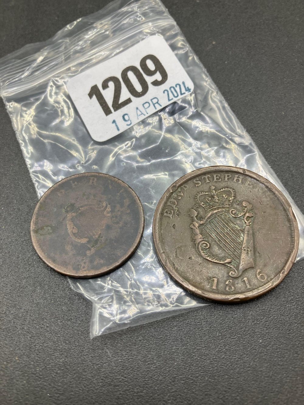 Wellington penny token and another