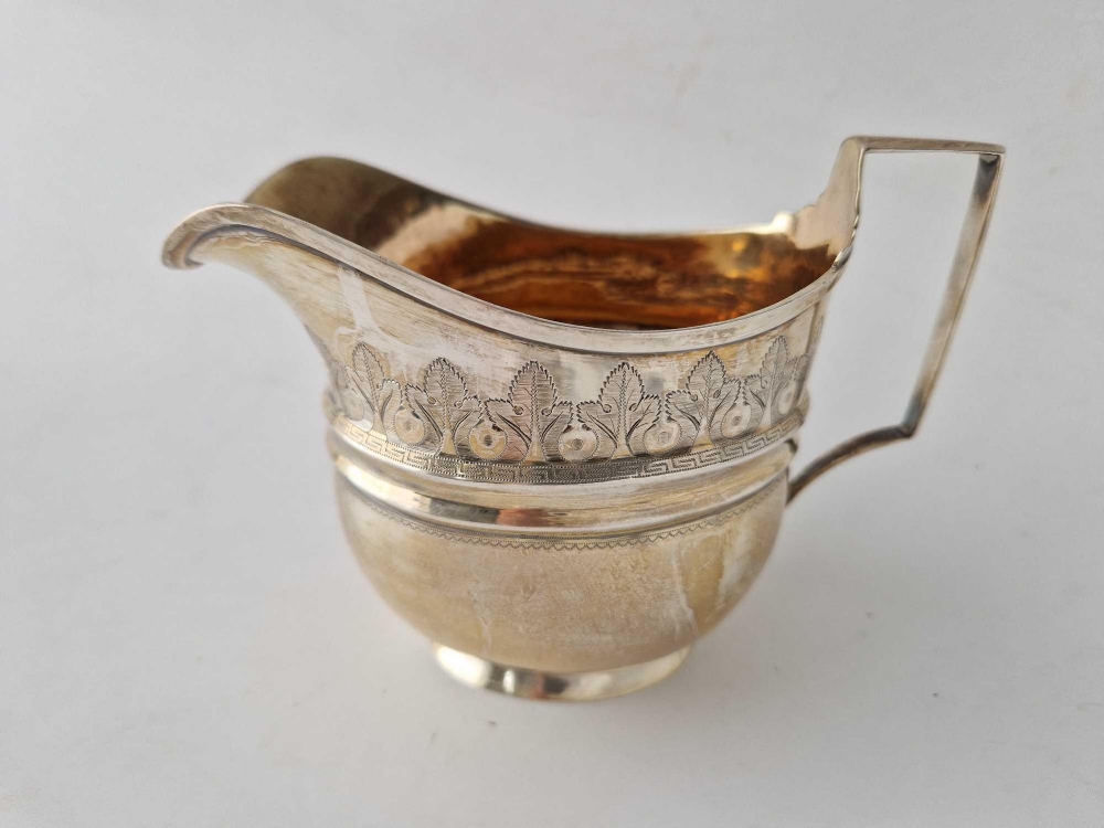 A good quality George III oval cream jug with a bright cut band, gilt interior, London 1806, 170 g - Image 3 of 3