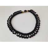 A black bead collar necklace