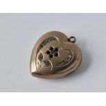 A gold heart locket set with gem stones, 5 g