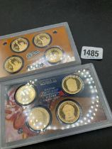 Two American gilt dollars proof sets