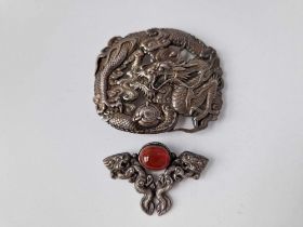 A large Chinese silver buckle and brooch, 70 g