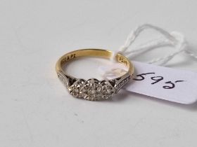 A three stone diamond ring, 18ct, size K, 2.2 g