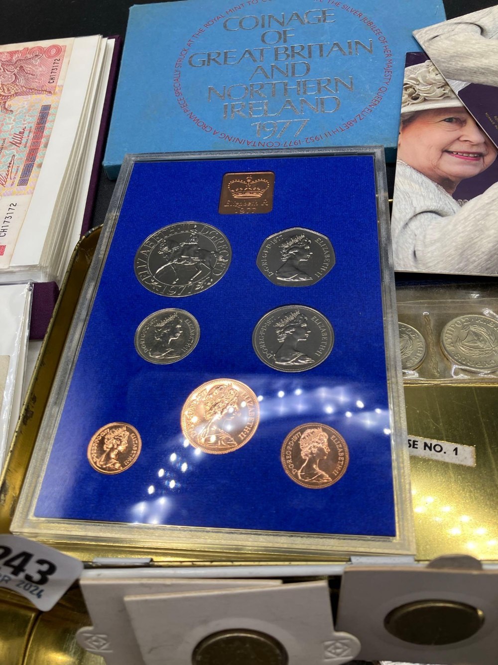 A tin of world coins and small bank not album - Image 2 of 4