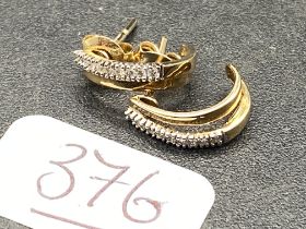 A pair of diamond half hoop 9ct earrings