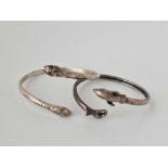 A snake and fish silver bangles