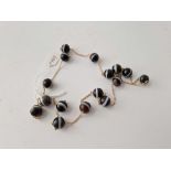 A banded agate style glass bead necklace 28”