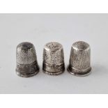 Group of three decorated thimbles . Birmingham 1904 etc