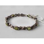 A silver and green stones bracelet, 7 inch
