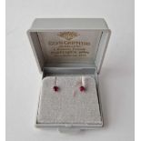 A pair of ruby ear studs 9ct