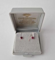 A pair of ruby ear studs 9ct