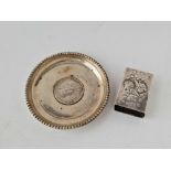 A circular dish inset with a coin dated 1918 and an angel decorated match box holder 1903