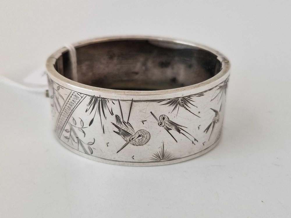An aesthetic engraved silver bangle, 26 g