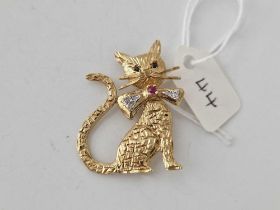 1950s Cat Brooch with exaggerated whiskers and bowtie set in diamonds with central ruby and Sapphire