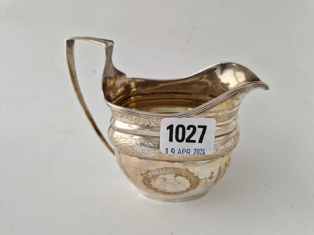 A George III cream jug with reeded rim, London 1806, 158 g