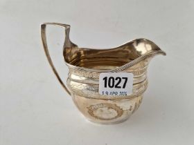 A George III cream jug with reeded rim, London 1806, 158 g
