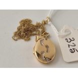 A locket on fine chain, both 9ct, 17 inch, 1.8 g