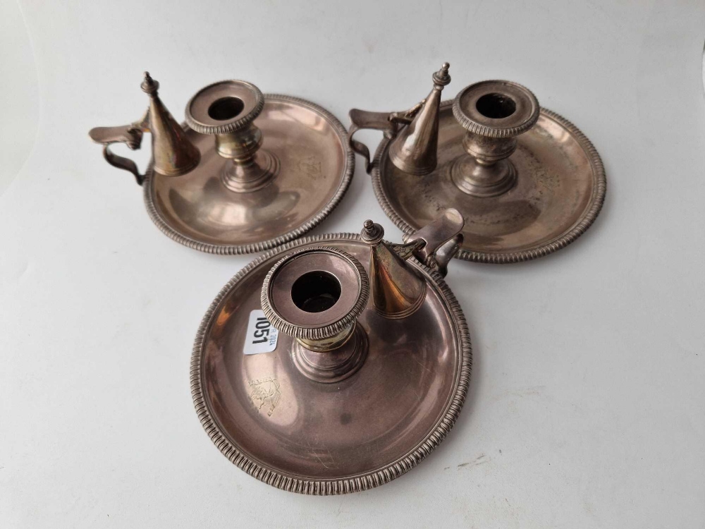 A good set of three early Victorian chamber candlesticks, the crested bodies, with detachable