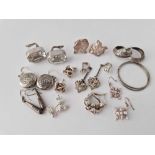 Eleven pairs of silver earrings, 58 g