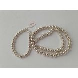 A silver ball bead necklace 17” and matching bracelet