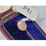 A gold opal terminal stick pin, boxed