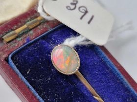 A gold opal terminal stick pin, boxed