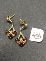 A small pair of garnet & 9ct earrings