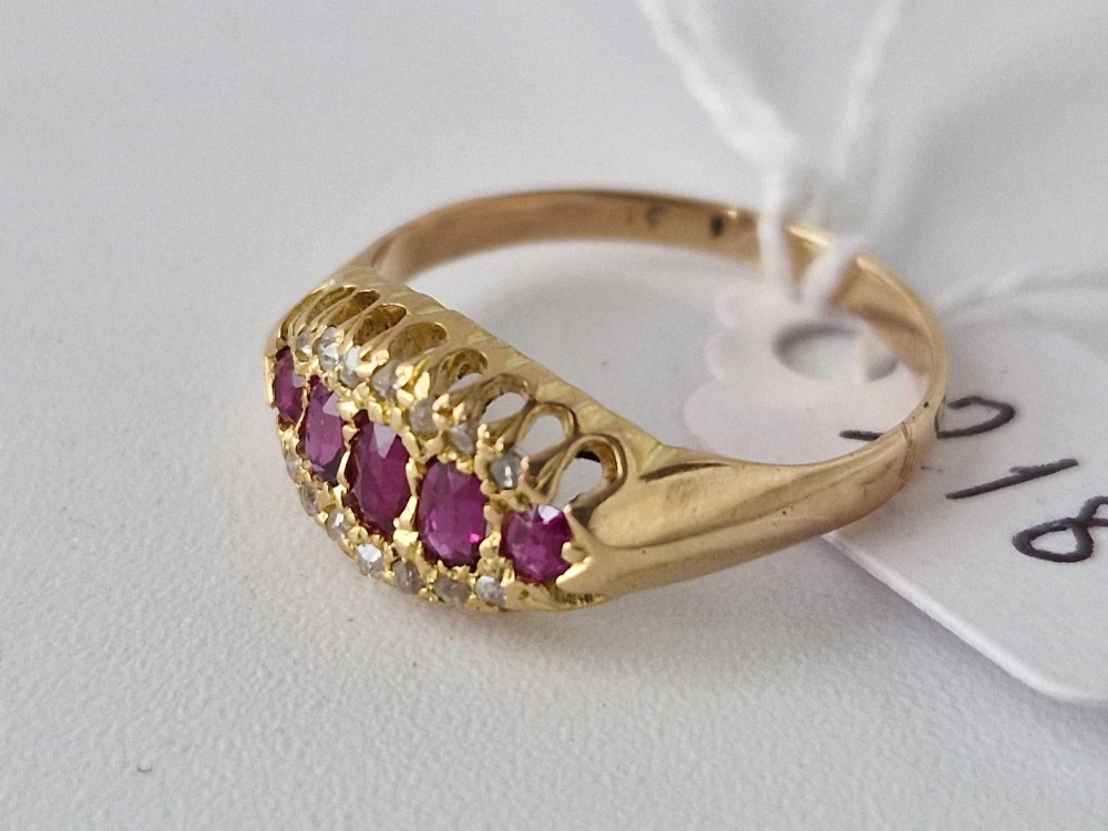 Antique Edwardian 18ct boat shaped ring, set with 5 central rubies, surrounded on either side by