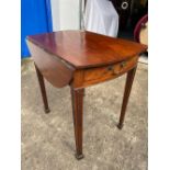 Early George III mahogany Pembroke table with oval top rounded ends on spade legs