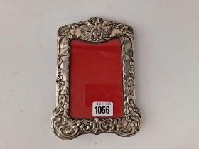 A Chester silver photo frame decorated with a cherub, 7.5 inches high, Chester 1901