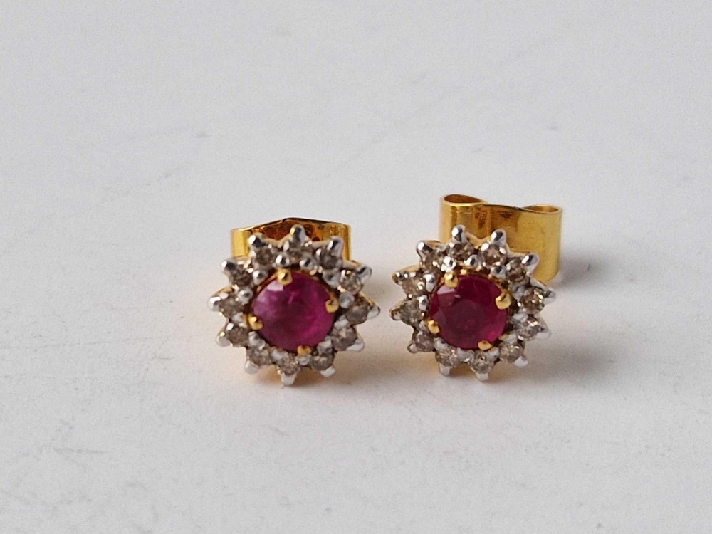 A pair of ruby & diamond 9ct cluster earrings
