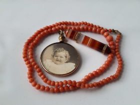 A coral necklace and two other pieces